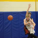 Mariner Japheth McGhee passes the ball during a basketball game between the Homer Mariners and the Kenai Kardinals on Friday, Dec. 21, 2018, at the Homer High School Alice Witte Gym in Homer, Alaska. (Photo by Michael Armstrong/Homer News)