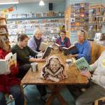 The staff and partners in the Homer Bookstore pose for a photo in the stores cafe in Homer, Alaska, on Oct. 29, 2018. From left to right are Sue Post, partner; Jennifer Norton, staff; Jennifer Stroyeck, partner; Nancy Vait, staff; Sara Reinert, staff; and Lee Post, partner. (Homer News file photo)