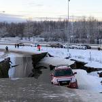 FILE - In this Friday, Nov. 30, 2018 file photo, Tom Sulcynskis vehicle is trapped on a section of road that collapsed during an earthquake in Anchorage, Alaska. The collapsed roadway that became an iconic image of the destructive force of a magnitude 7.0 earthquake and its aftershocks was repaired just days after the quake. The off-ramp connecting Minnesota Drive and a road to Ted Stevens Anchorage International Airport reopened Tuesday, Dec. 4, 2018, with shoulder work finished Wednesday. (AP Photo/Dan Joling, File )