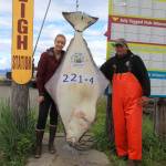 Ashley Camp, left, of Vancouver, British Columbia, Canada, poses with her 221.4-pound halibut caught on July 28, 2018 near Homer, Alaska. (Homer News file photo)