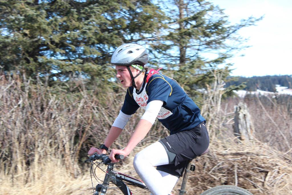 Homer High School senior Denver Waclawski bikes into the second transition station of this years Sea to Ski Triathlon. He finished first in all three legs of the race and took first place overall Sunday, March 25, 2017 in Homer, Alaska. (Homer News file photo)
