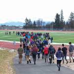 About 100 Homer High School students gather on the football field during a walkout staged Wednesday, Feb. 21, 2018 to protest for safer schools and honor the students killed in the Valentines Day mass shooting in Parkland, Florida. The students formed the number 17 with their bodies on the field. (Homer News file photo)