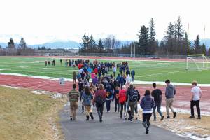 About 100 Homer High School students gather on the football field during a walkout staged Wednesday, Feb. 21, 2018 to protest for safer schools and honor the students killed in the Valentines Day mass shooting in Parkland, Florida. The students formed the number 17 with their bodies on the field. (Homer News file photo)