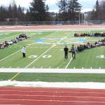 About 100 Homer High School students lie down on the schools football field to form the number 17 on Wednesday, Feb. 21, 2018, to honor the students who were killed in the Feb. 14 mass shooting in Parkland, Florida. The Homer students staged a walkout at noon to advocate for safer schools. (Homer News file photo)