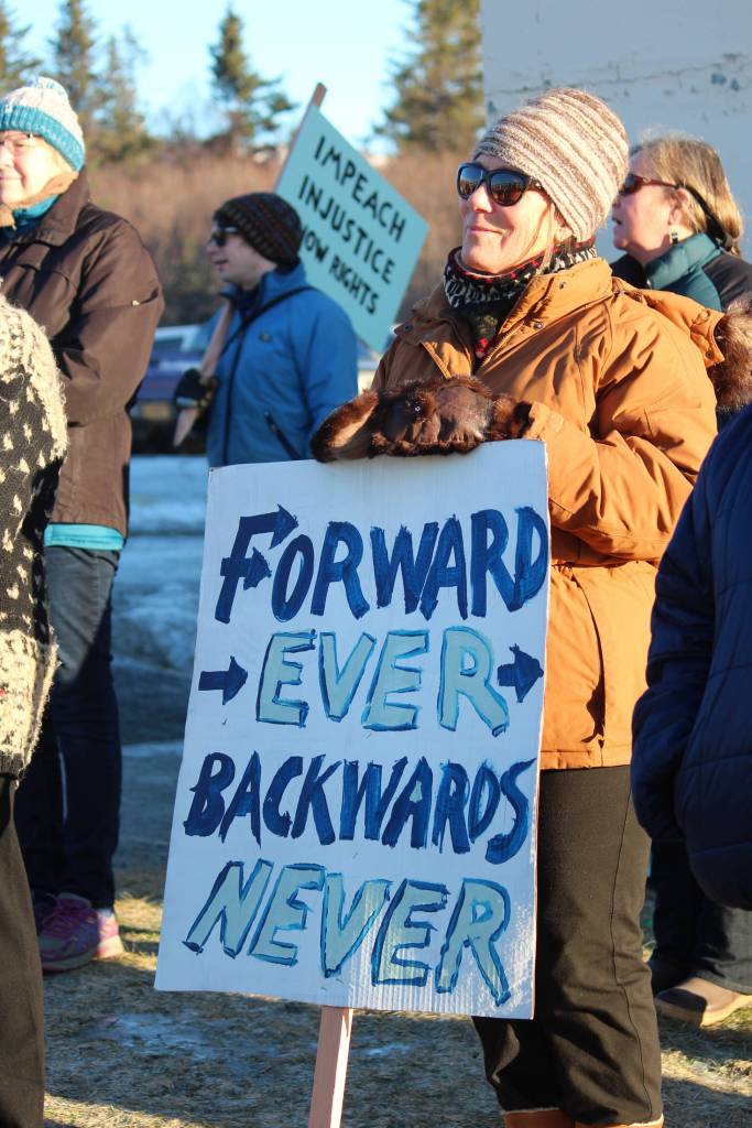 A 2019 Womens March on Homer participant holds a sign while listening to speakers Saturday, Jan. 19, 2019 at the Homer Education and Recreation Complex in Homer, Alaska. (Photo by Megan Pacer/Homer News)