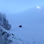 Along the Sterling Highway, people pitch a small shack on a frozen lake to go ice fishing near Cooper Landing, Alaska, on Saturday, Jan. 19, 2019. (Photo by Victoria Petersen/Peninsula Clarion)