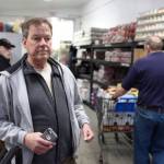 Eric Adam watches as food is distributed at the Southeast Alaska Food Bank on Monday, Jan 21, 2019. Adam works as an administrative assistant with the U.S. Forest Service. Adam has set up a Facebook page to help federal employees not currently receiving a paycheck because of the partial federal shutdown. (Michael Penn | Juneau Empire)