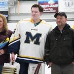 Homer senior Connor Roderick is honored with his parents on Senior Night for the Homer High School hockey team Thursday, Jan. 24, 2019 at Kevin Bell Ice Arena in Homer, Alaska. The Mariners defeated Houston High School 10-1. (Photo by Megan Pacer/Homer News)