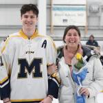 Homer senior Tucker Weston is honored with his mother on Senior Night for the Homer High School hockey team Thursday, Jan. 24, 2019 at Kevin Bell Ice Arena in Homer, Alaska. The Mariners defeated Houston High School 10-1. (Photo by Megan Pacer/Homer News)