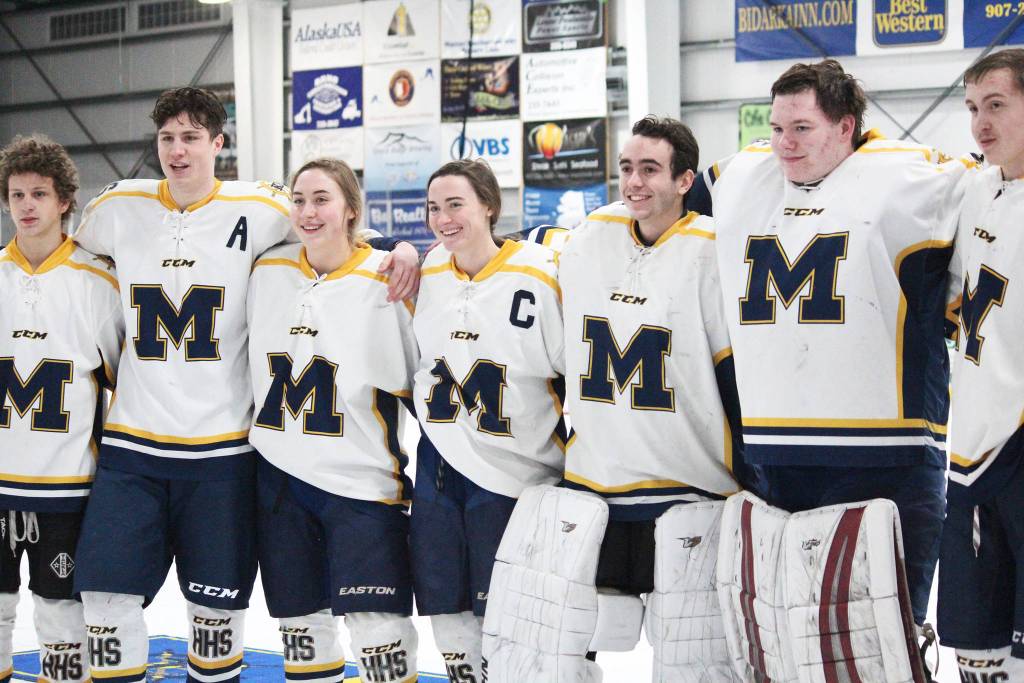Senior members of the Homer High School hockey team pose for a photo on Senior Night between periods of a Thursday, Jan. 24, 2019 game against Houston High School at Kevin Bell Ice Arena in Homer, Alaska. (Photo by Megan Pacer/Homer News)