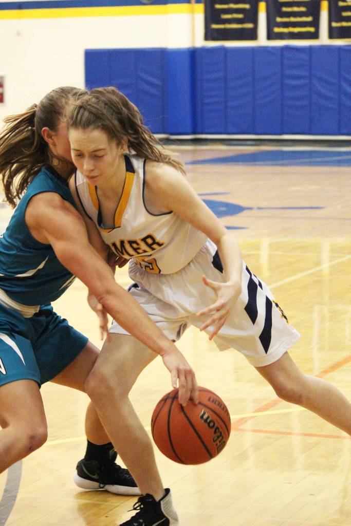 Nikiskis Kaitlyn Johnson tries to snag the ball from Homers Kaylin Anderson during a Friday, Jan. 25, 2019 game at the Alice Witte Gymnasium in Homer, Alaska. (Photo by Megan Pacer/Homer News)