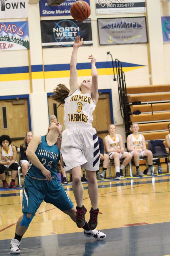 Homers Laura Inama takes a shot at the Nikiski basket during a Friday, Jan. 25, 2019 game at the Alice Witte Gymnasium in Homer, Alaska. (Photo by Megan Pacer/Homer News)