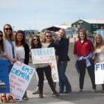 A group of U.S. Coast Guard wives wait at the Pioneer Dock in August 2015 to greet their husbands after a four-month deployment on the U.S. Coast Guard Cutter Hickory. From left to right are Melissa Parker, Nicole Ziemba, Kaitlyn Burns, Emily Davis, Lyndsay McGarran, Carly Robinson, Madison Russell and Laura Hupp. (Photo by Michael Armstrong/Home news)