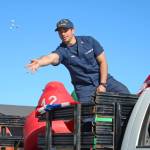 A member of the U.S. Coast Guard tosses candy to children and families lining Pioneer Avenue during the annual Independence Day parade Wednesday, July 4, 2018 in Homer, Alaska. Coast Guard participants were representing the U.S. Coast Guard Cutter Hickory, also called the Bull of the North. (Photo by Megan Pacer/Homer News)                                A member of the U.S. Coast Guard tosses candy to children and families lining Pioneer Avenue during the annual Independence Day parade Wednesday, July 4, 2018 in Homer, Alaska. Coast Guard participants were representing the U.S. Coast Guard Cutter Hickory, also called the Bull of the North. (Photo by Megan Pacer/Homer News)