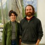 Elissa and David Pettibone pose on Tuesday, Oct. 16, 2018, by one of David Pettibones paintings at The Shop, an art space the Pettibones started in August 2018 in Kachemak City, Alaska. (Photo by Michael Armstrong/Homer News)