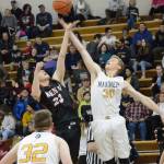 Mariner Japhet McGee wins the tip-off during a basketball game between the Homer Mariners and the Kenai Kardinals on Friday, Dec. 21, 2018, at the Homer High School Alice Witte Gym in Homer, Alaska. (Photo by Michael Armstrong/Homer News)
