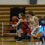 Kardinal Hayley Maw drives the ball down court during a game against the Homer Mariner girls basketball team on Friday, Dec. 21, 2018, in Homer, Alaska. (Photo by Michael Armstrong/Homer News)