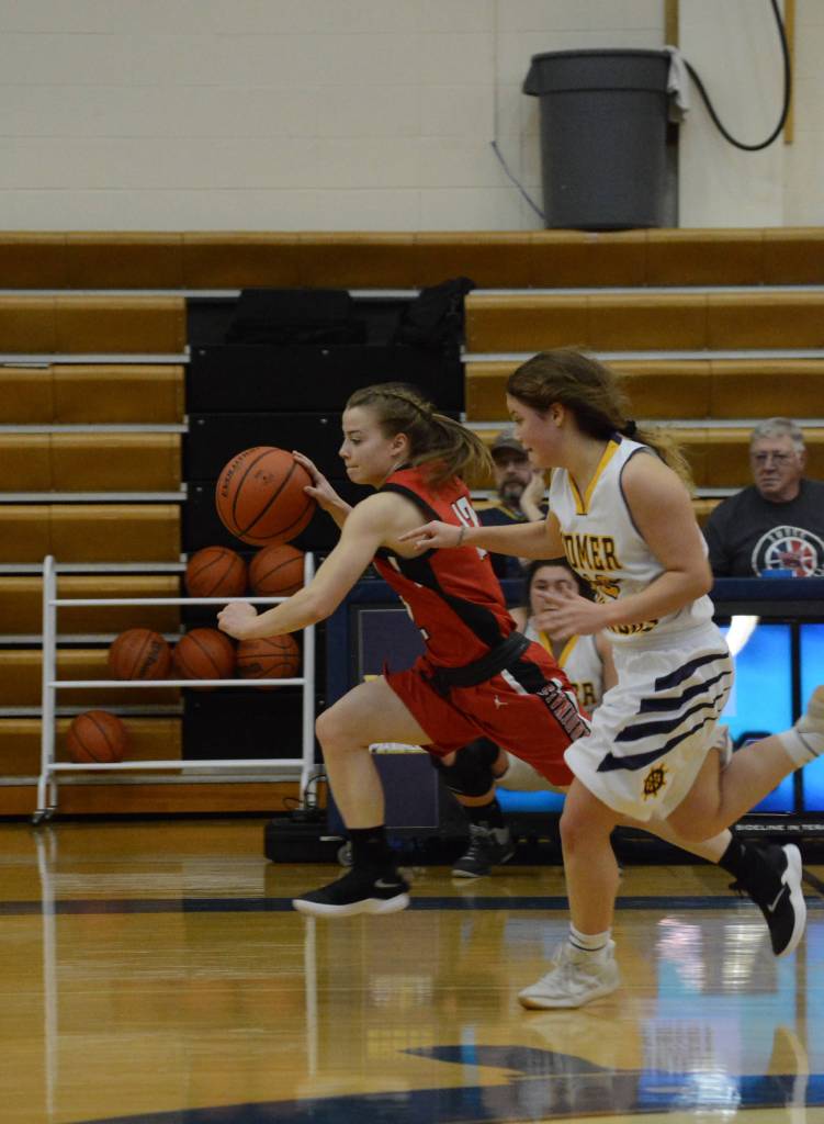 Kardinal Hayley Maw drives the ball down court during a game against the Homer Mariner girls basketball team on Friday, Dec. 21, 2018, in Homer, Alaska. (Photo by Michael Armstrong/Homer News)