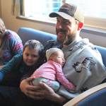 <span class="neFMT neFMT_PhotoCredit">Photo by Megan Pacer/Homer News</span>                                Owen Bettinger and his son, Juneau, relax with new daughter, Sequoia, while his wife, Allyse, fills out some paperwork Tuesday, Jan. 8, 2019 at South Peninsula Hospital in Homer, Alaska. Sequoia was the first baby born in the new year on Jan. 1.