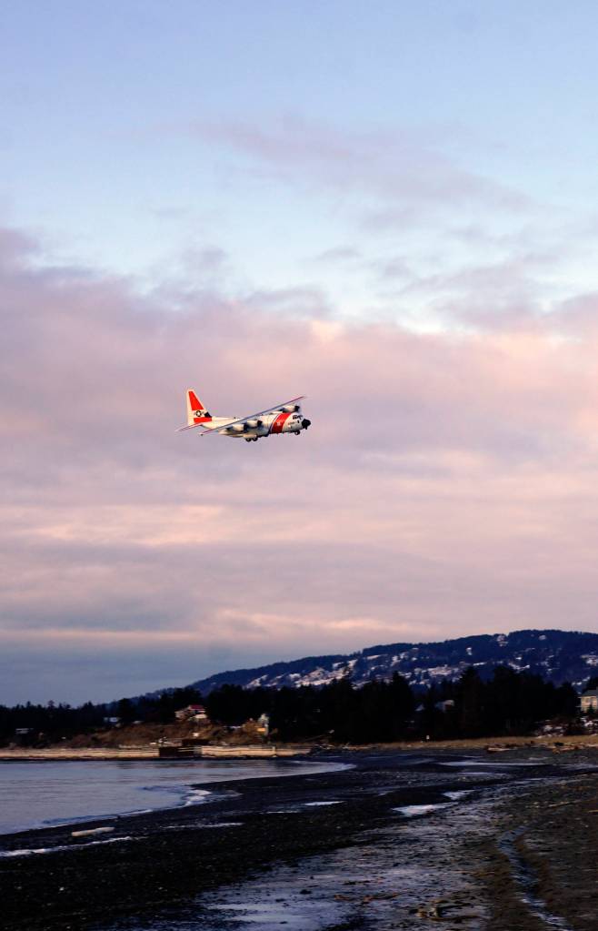 Still working A U.S. Coast Guard C-130 plane flies over the Homer Spit on Tuesday, Jan. 8, 2019, as the pilot practices touch-and-gos at the Homer Airport in Homer, Alaska. The Coast Guard is one of the federal agencies affected by the shutdown. (Photo by Michael Armstrong/Homer News)
