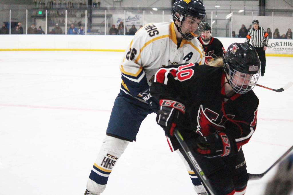 <span class="neFMT neFMT_PhotoCredit">Photo by Megan Pacer/Homer News</span>                                Kenai skater Jordyn Stock tries to keep control of the puck under pressure from Homers Ethan Pitzman on Tuesday, Jan. 8, 2019 at Kevon Bell Ice Arena in Homer.