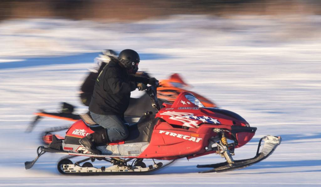 <span class="neFMT neFMT_PhotoCredit">(Photo by Joey Klecka/Peninsula Clarion)</span>                                 Freddie Pollard Jr. (front) races fellow competitor George Derkevorkian in a heat race Saturday afternoon at the snowmachine drag races at Freddies Roadhouse near Ninilchik.