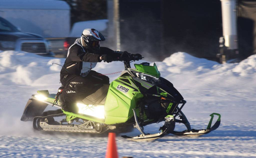 Richard Derkevorkian makes a pass in a heat race Saturday afternoon at the snowmachine drag races at Freddies Roadhouse near Ninilchik. (Photo by Joey Klecka/Peninsula Clarion)