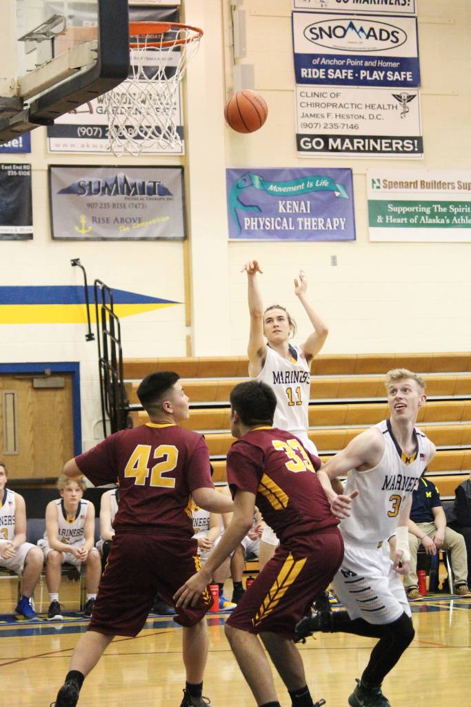 Homers Daniel Reutov takes a shot during a Thursday, Jan. 10, 2019 game against Mt. Edgecumbe in Homer, Alaska. (Photo by Megan Pacer/Homer News)