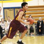 Mt. Edgecumbes RJ Alstrom-Beans moves down the court under the pursuit of Homers Seth Adkins during a Thursday, Jan. 10, 2019 game in Homer, Alaska. (Photo by Megan Pacer/Homer News)