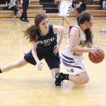 Homers Hannah Hatfield wins a loose ball from Soldotna High Schools Morgan Bouschor during a Tuesday, Jan. 15, 2019 game in Homer, Alaska. (Photo by Megan Pacer/Homer News)