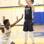 Soldotnas Ray Chumley sets up a shot under the guard of Homers Eyoab Knapp during a Thursday, Jan. 15, 2019 game in Homer, Alaska. (Photo by Megan Pacer/Homer News)
