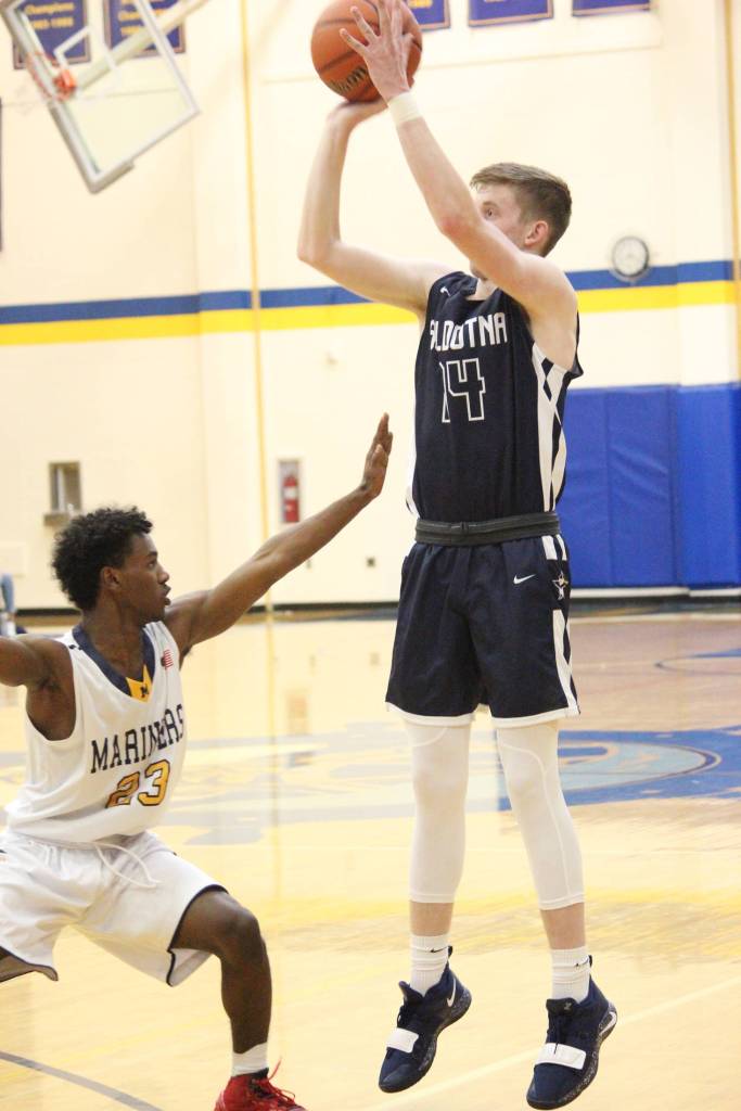 Soldotnas Ray Chumley sets up a shot under the guard of Homers Eyoab Knapp during a Thursday, Jan. 15, 2019 game in Homer, Alaska. (Photo by Megan Pacer/Homer News)
