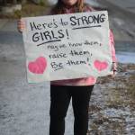 Hope Stearns holds a sign in the Homer March for Women on Saturday. About 700 people walked in the march along Pioneer Avenue on Jan. 20, 2018, in Homer, Alaska. The line of marchers extended from Main Street to Kachemak Way. (Photo by Michael Armstrong/Homer News)