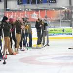 Former Olympic curler Jessica Schultz explains the basics of the sport to a group of people Saturday, Jan. 12, 2019 at the Kevin Bell Ice Arena in Homer, Alaska during a fundraiser event for the Homer Curling Club. (Photo by Megan Pacer/Homer News)
