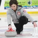 Former Olympic curler Jessica Schultz demonstrates the proper way to deliver a curling stone Saturday, Jan. 12, 2019 at the Kevin Bell Ice Arena in Homer, Alaska during a fundraiser event for the Homer Curling Club. (Photo by Megan Pacer/Homer News)