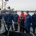 Lt. Gov. Boyd K. Rutherford (orange suit) poses with crew members of the Coast Guard Cutter Chock during the lieutenant governors visit aboard the cutter moored up at Curtis Bay in Maryland, Wednesday, Jan. 20, 2016. Rutherford visited with Coast Guard crews from Sector Baltimore, Station Curtis Bay and the cutter Chock. Chief Petty Officer Michael Kozloski, later promoted to Chief Warrant Officer, is second from right.(U.S. Coast Guard photo by Petty Officer David R. Marin)