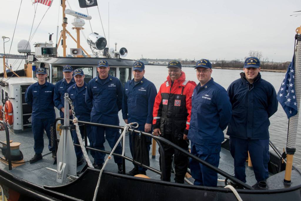 Lt. Gov. Boyd K. Rutherford (orange suit) poses with crew members of the Coast Guard Cutter Chock during the lieutenant governors visit aboard the cutter moored up at Curtis Bay in Maryland, Wednesday, Jan. 20, 2016. Rutherford visited with Coast Guard crews from Sector Baltimore, Station Curtis Bay and the cutter Chock. Chief Petty Officer Michael Kozloski, later promoted to Chief Warrant Officer, is second from right.(U.S. Coast Guard photo by Petty Officer David R. Marin)