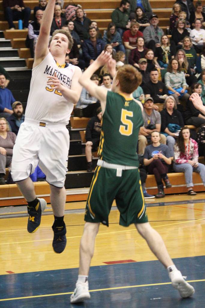Homers Stanley Swoboda takes a shot at Sewards basket Friday, Feb. 8, 2019 during the Winter Carnival Basketball Tournament in Homer, Alaska. (Photo by Megan Pacer/Homer News)
