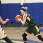 Sewards Katelyn Lemme looks for a way around Homers Alia Bales on Friday, Feb. 8, 2019 during the Winter Carnival Basketball Tournament in Homer, Alaska. (Photo by Megan Pacer/Homer News)
