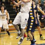 Homers Seth Adkins looks for a place to send the ball while under pressure from Galena players Thursday, Feb. 7, 2019 during the Winter Carnival Basketball Tournament in Homer, Alaska. (Photo by Megan Pacer/Homer News)
