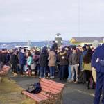 Friends and crew mates of Chief Warrant Officer Michael Kozloski meet after a memorial service for him on Friday morning, Feb. 8, 2019, at the Seafarers Memorial on the Homer Spit, Homer, Alaska. (Photo by Michael Armstrong/Homer News)