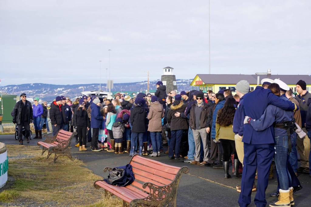 Friends and crew mates of Chief Warrant Officer Michael Kozloski meet after a memorial service for him on Friday morning, Feb. 8, 2019, at the Seafarers Memorial on the Homer Spit, Homer, Alaska. (Photo by Michael Armstrong/Homer News)