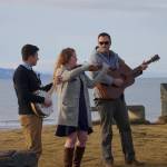 From left to right, Josh Kennedy, Kate Klann and Geddy Miller perform I Bid You Goodbye at a memorial service for Chief Warrant Officer Michael Kozloski on Friday morning, Feb. 8, 2019, at the Seafarers Memorial on the Homer Spit, Homer, Alaska. Kennedy served on the U.S. Coast Cutter Hickory with Kozloski and Miller is captain of the U.S. Coast Guard Cutter Naushon. (Photo by Michael Armstrong/Homer News)