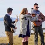 From left to right, Josh Kennedy, Kate Klann and Geddy Miller perform I Bid You Goodbye at a memorial service for Chief Warrant Officer Michael Kozloski on Friday morning, Feb. 8, 2019, at the Seafarers Memorial on the Homer Spit, Homer, Alaska. Kennedy served on the U.S. Coast Cutter Hickory with Kozloski and Miller is captain of the U.S. Coast Guard Cutter Naushon. (Photo by Michael Armstrong/Homer News)
