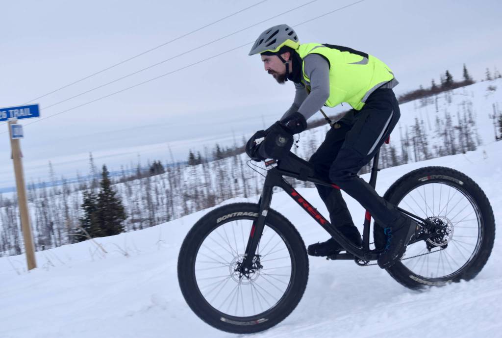 Nathan Kincaid flies down a hill during Fat Freddies Bike Race and Ramble on Feb. 9, 2019, in the Caribou Hills near Freddies Roadhouse. (Photo by Jeff Helminiak/Peninsula Clarion)