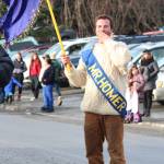Anthony DiCosola, winner of the 2019 Mr. Homer Pageant, blows a kiss to the crowd Saturday, Feb. 9, 2019 at the Winter Carnival Parade in Homer, Alaska. (Photo by Megan Pacer/Homer News)