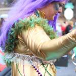 Photo by Megan Pacer/Homer News                                A woman dressed as a mermaid marches down Pioneer Avenue with the Krewe of Gambrinus on Saturday, Feb. 9 at the Winter Carnival Parade in Homer.