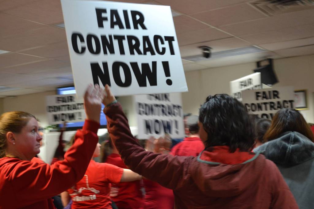 District employees leave the Betty J. Glick Borough Assembly Chambers during the Kenai Peninsula Borough School District Education Board meeting in Soldotna, Alaska on Monday, Feb. 11, 2019, to rally for a fair contract. (Photo by Victoria Petersen/Peninsula Clarion)