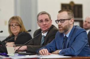 Andy Jones, Director of the Department of Health and Social Services Office of Substance Misuse, right, speak about the fiscal impacts of the opioids on the state along with Michael Duxbury, Deputy Commissioner of the Department of Public Safety, center, and Laura Brooks, Director of Health and Rehabilitation for the Department of Corrections, in front of the Senate Finance Committee on Thursday, Feb. 7, 2019. (Michael Penn | Juneau Empire)