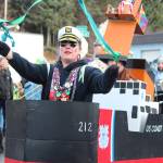 A marcher with the Krewe of Gambrinus dances during the Winter Carnival Parade on Saturday, Feb. 9, 2019 in Homer, Alaska. (Photo by Megan Pacer/Homer News)